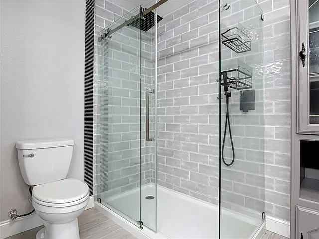 a view of a livingroom with a chandelier fan