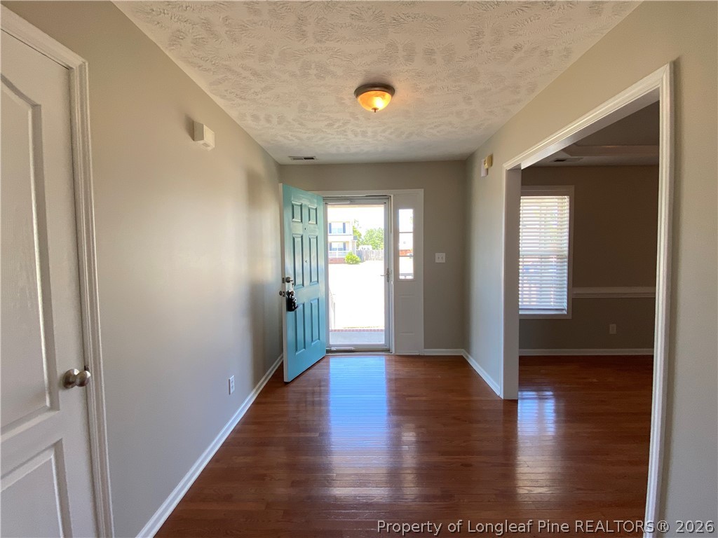 58 Polk Street Spring Lake, NC 28390 - Photo 3 of 26 a view of an entryway with wooden floor