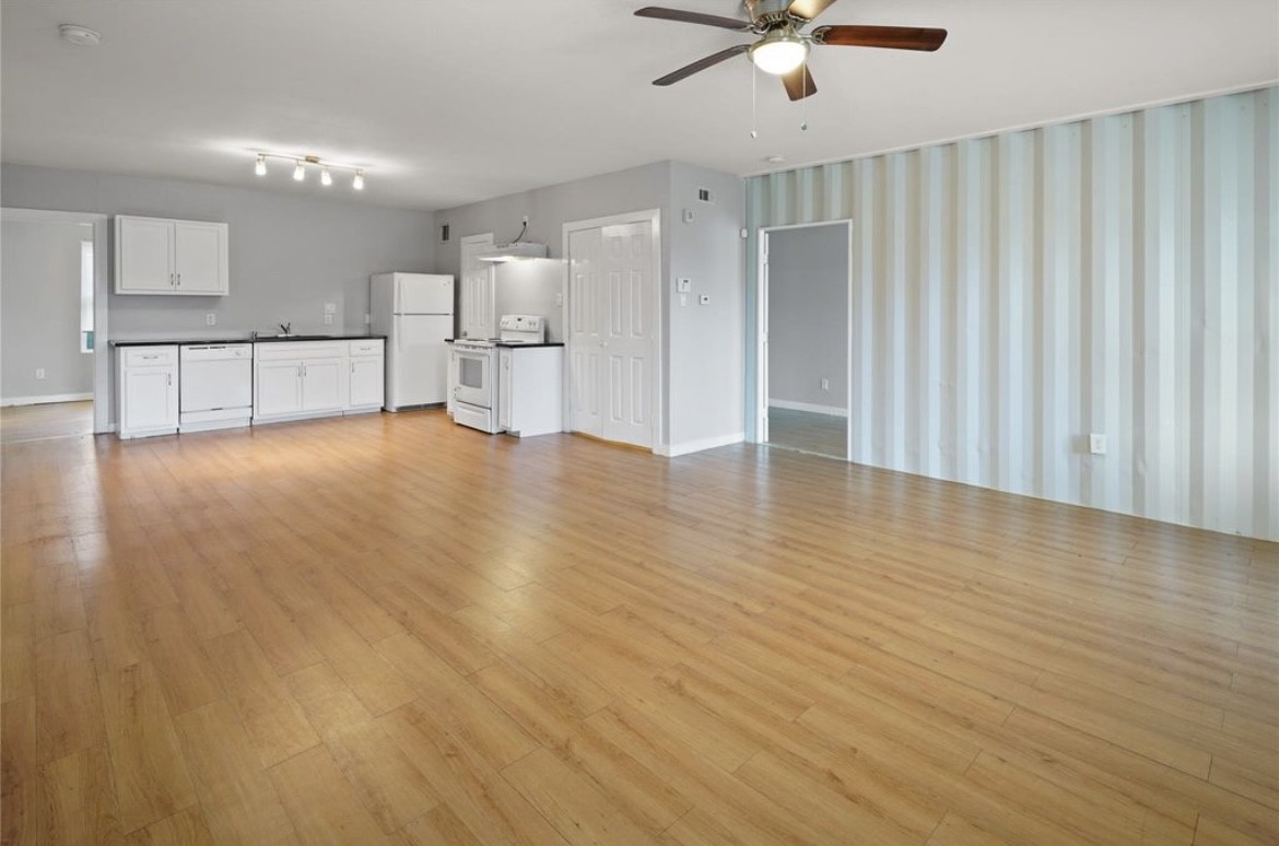 a view of a kitchen with a dishwasher cabinet and a microwave