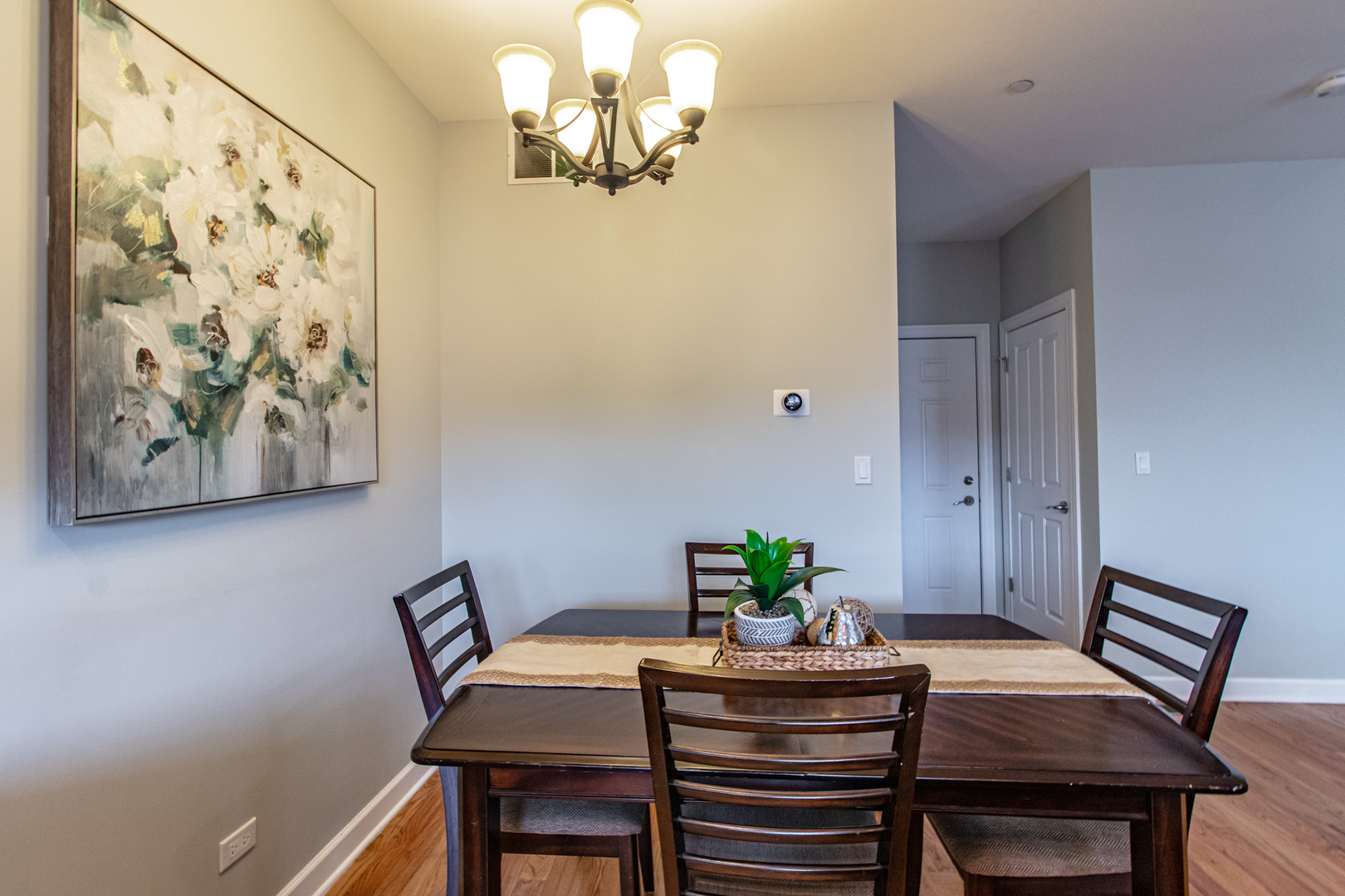 48 Northfield Terrace Wheeling, IL 60090 - Photo 12 of 36 a dining room with furniture and wooden floor