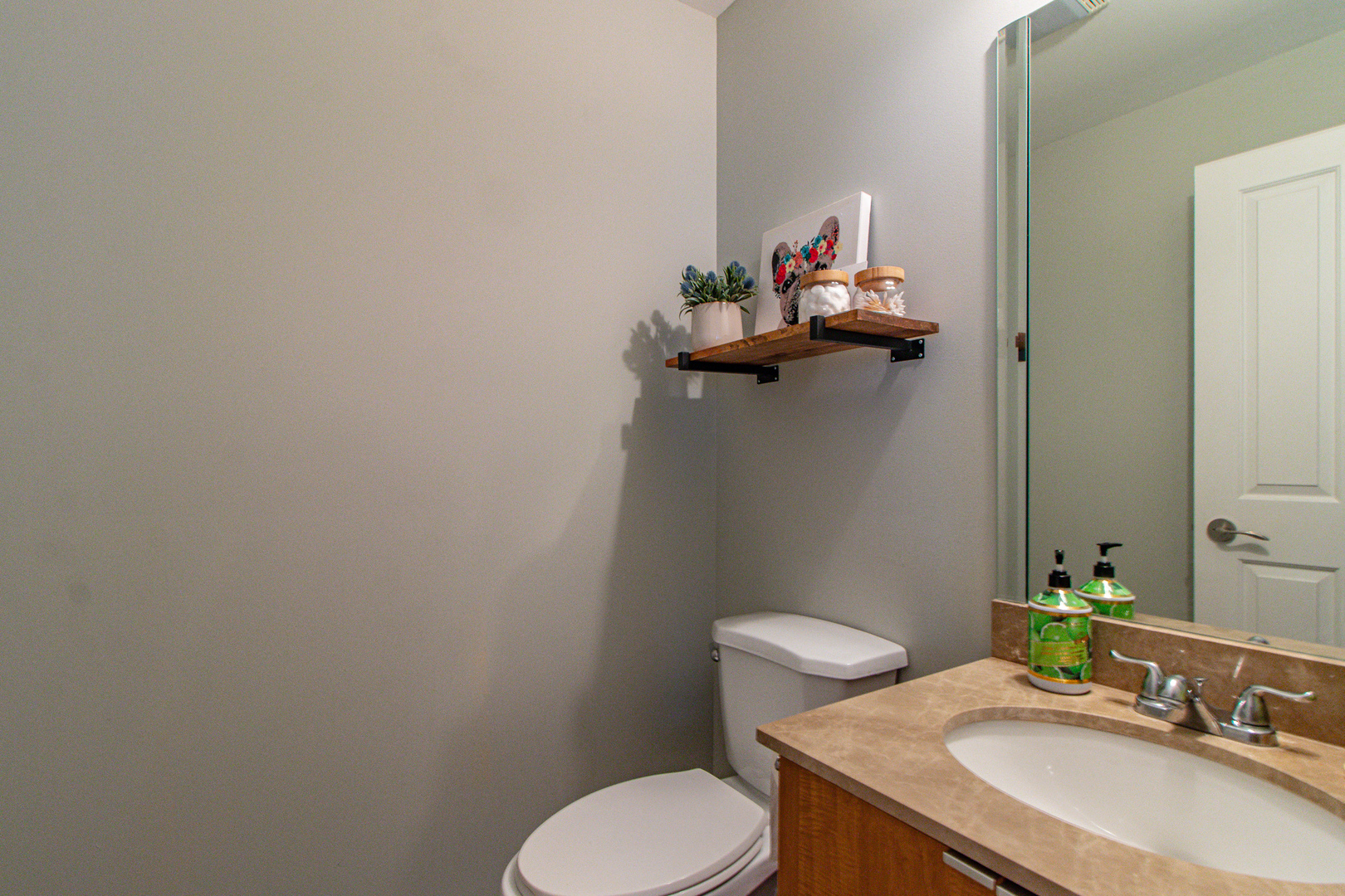 48 Northfield Terrace Wheeling, IL 60090 - Photo 16 of 36 a bathroom with a sink toilet and a mirror