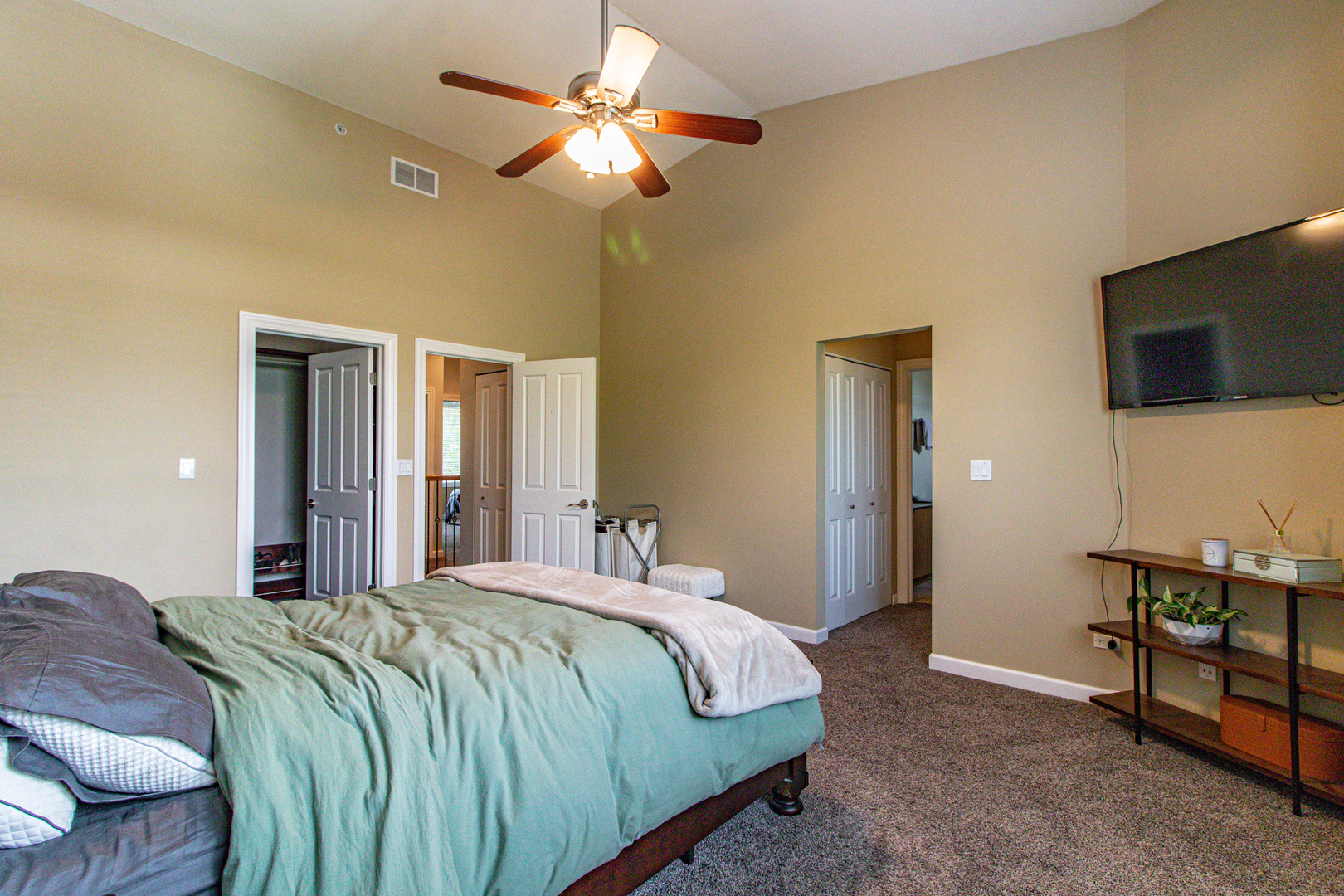 48 Northfield Terrace Wheeling, IL 60090 - Photo 19 of 36 a bedroom with a bed and a chandelier