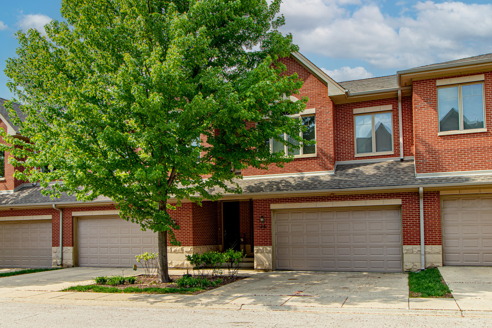 48 Northfield Terrace Wheeling, IL 60090 - Photo 2 of 36 a front view of a house with a yard