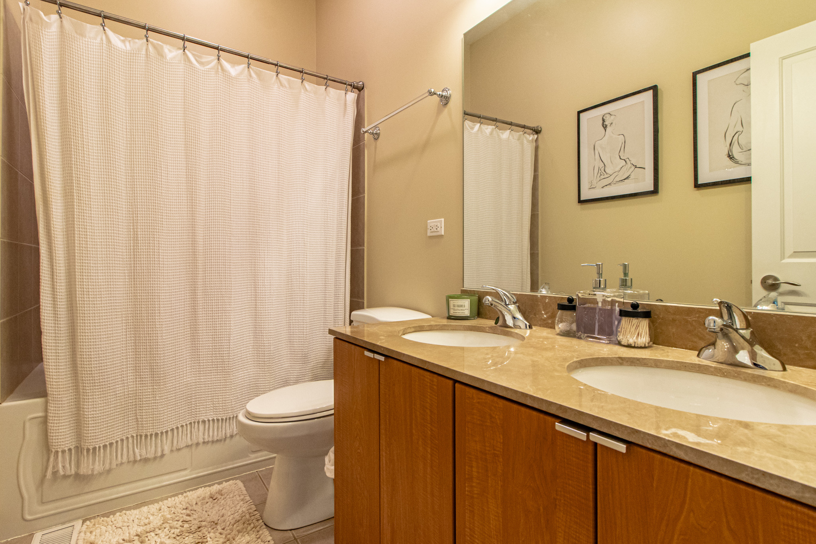 48 Northfield Terrace Wheeling, IL 60090 - Photo 26 of 36 a bathroom with a granite countertop sink and a mirror