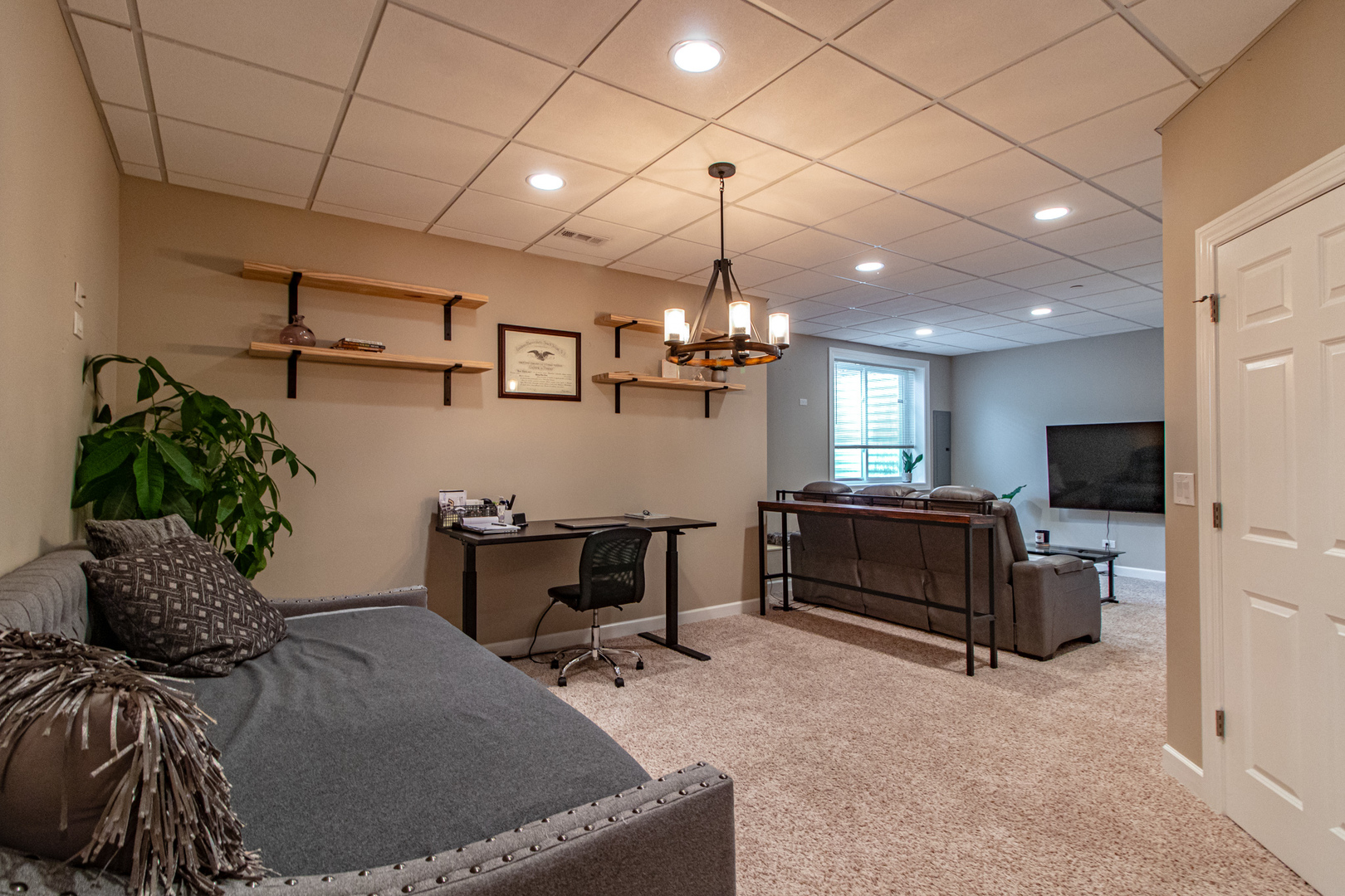 48 Northfield Terrace Wheeling, IL 60090 - Photo 28 of 36 a living room with furniture and a flat screen tv