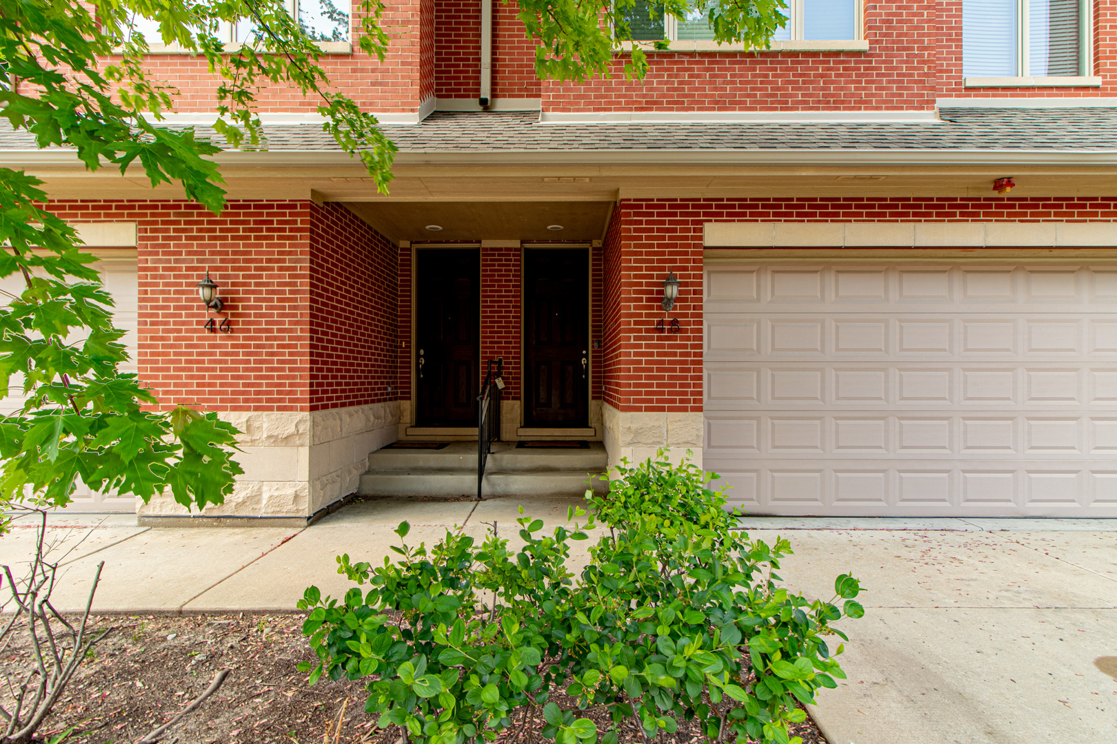 48 Northfield Terrace Wheeling, IL 60090 - Photo 3 of 36 a front view of a house with garden