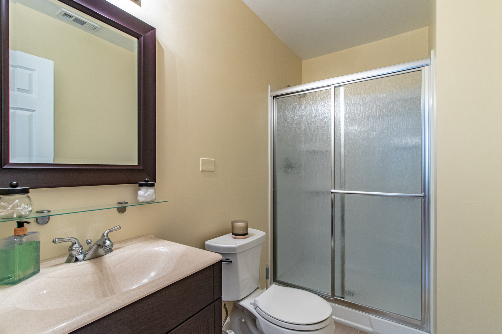 48 Northfield Terrace Wheeling, IL 60090 - Photo 33 of 36 a bathroom with a sink vanity mirror and toilet