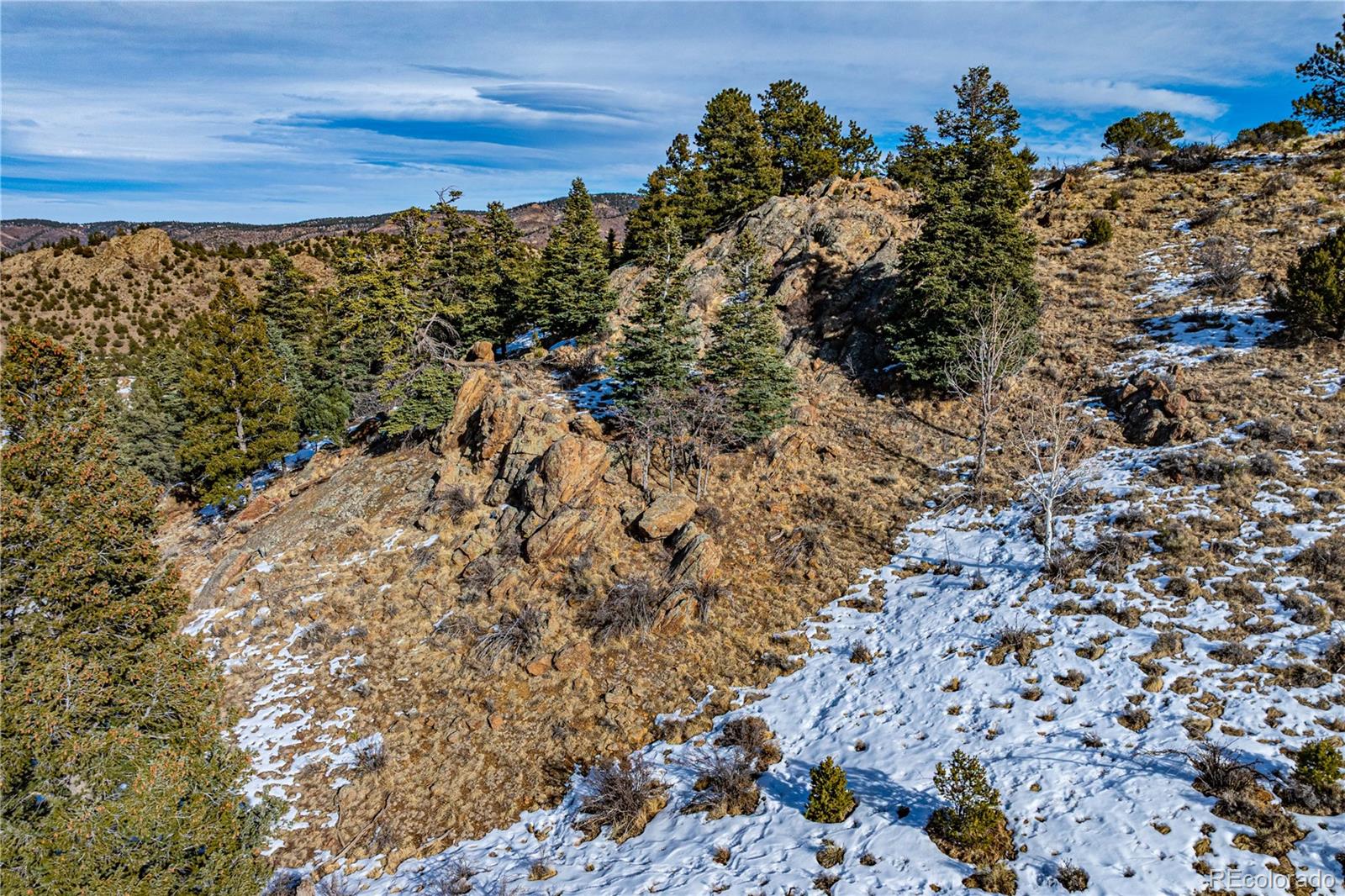 740 Dilley Road Westcliffe, CO 81252 - Photo 3 of 36 a view of a large building with a mountain view