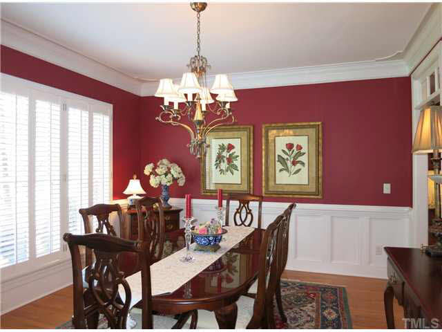 7209 Sparhawk Road Wake Forest, NC 27587 - Photo 4 of 25 To the left of the Foyer is the formal Dining Rm w/panel wainscot, chair rail, detailed ceiling molding, & plantation shutters & brushed nickel light fixture. Dining Room