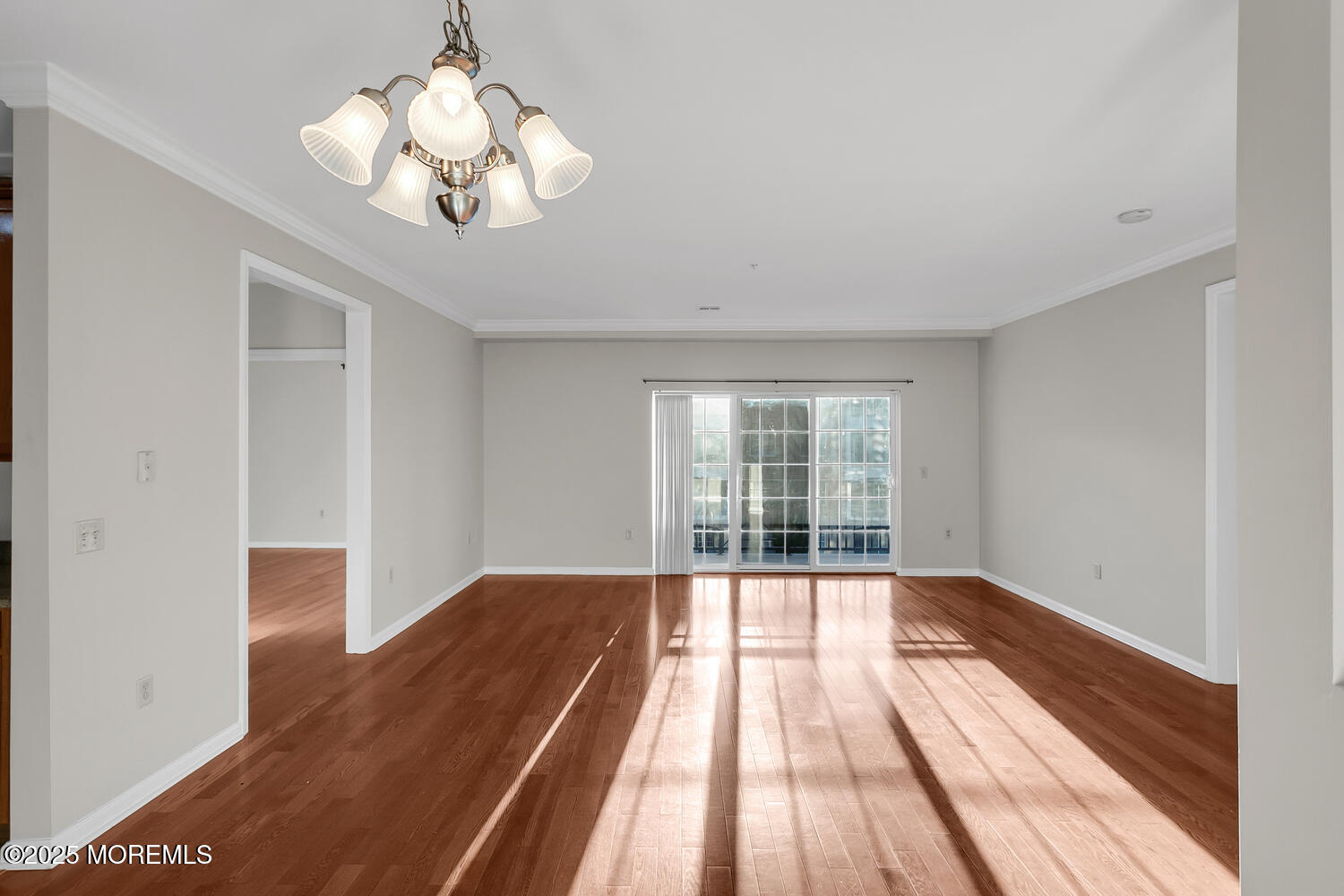 325 Regency Place Woodbridge, NJ 07095 - Photo 20 of 37 a view of an empty room with wooden floor and a window