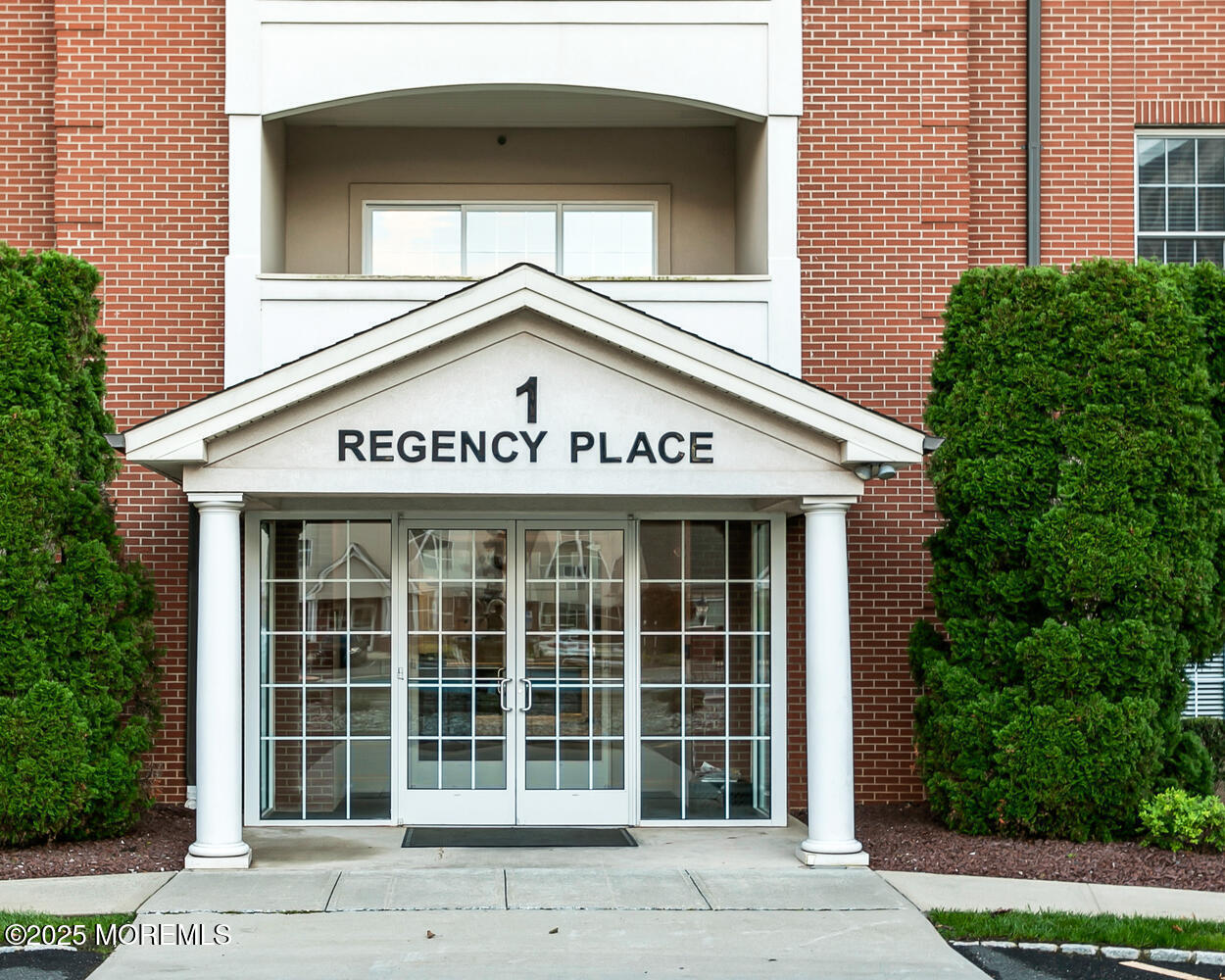 325 Regency Place Woodbridge, NJ 07095 - Photo 2 of 37 a sign on the side of a building