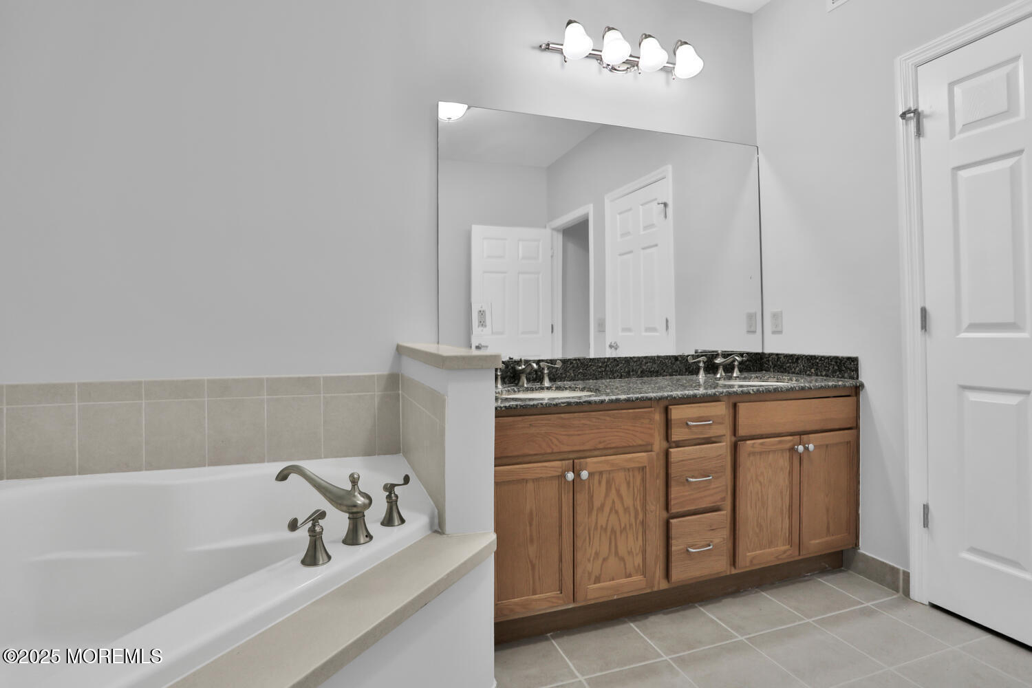 325 Regency Place Woodbridge, NJ 07095 - Photo 23 of 37 a bathroom with a sink and a bathtub