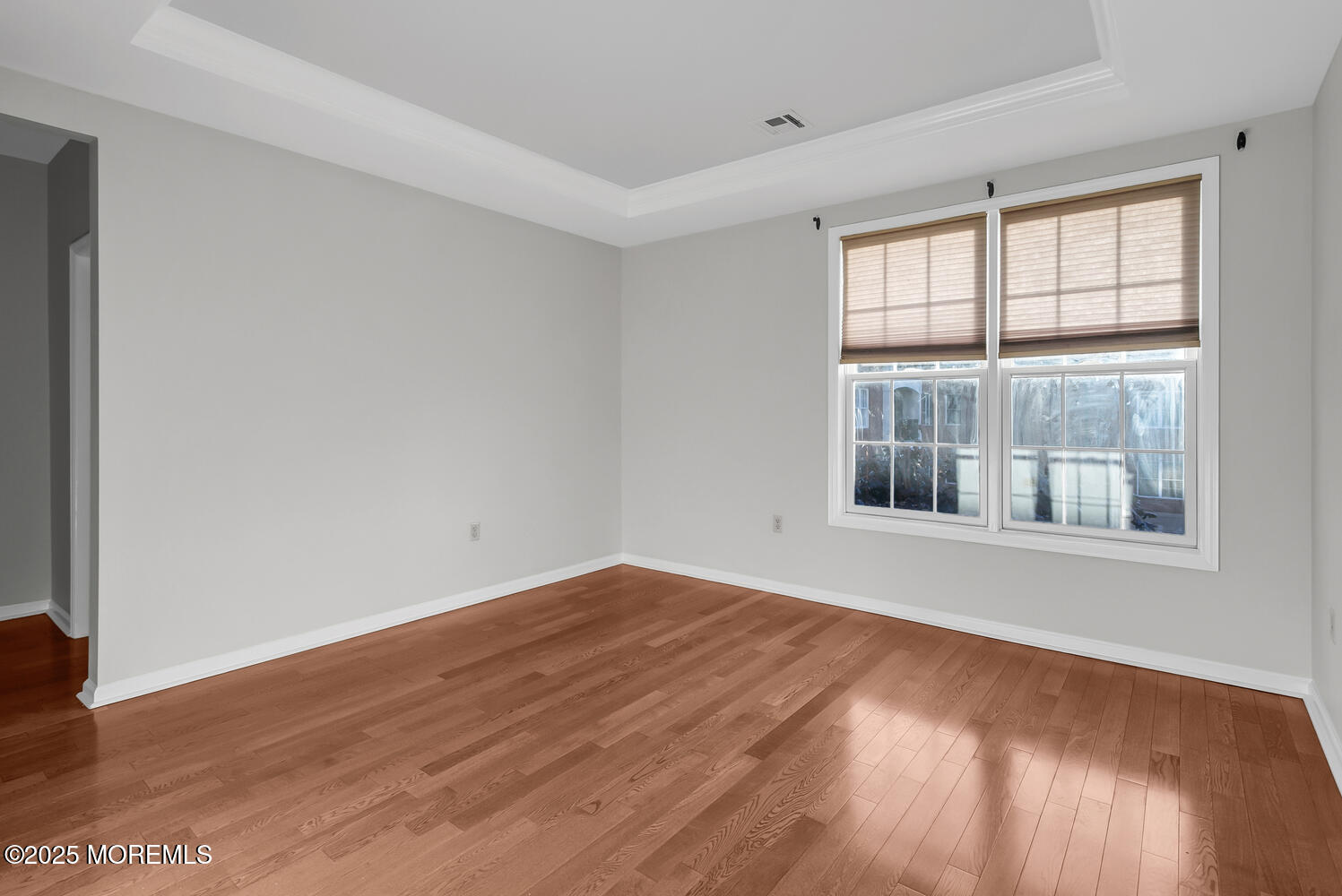 325 Regency Place Woodbridge, NJ 07095 - Photo 24 of 37 an empty room with wooden floor and windows