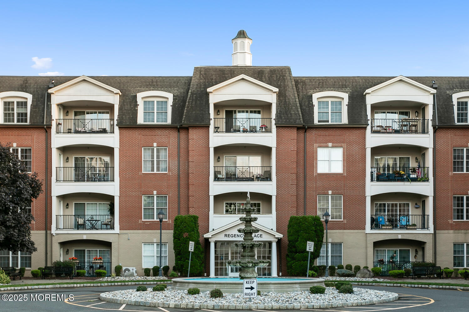 325 Regency Place Woodbridge, NJ 07095 - Photo 34 of 37 a front view of a building with a yard