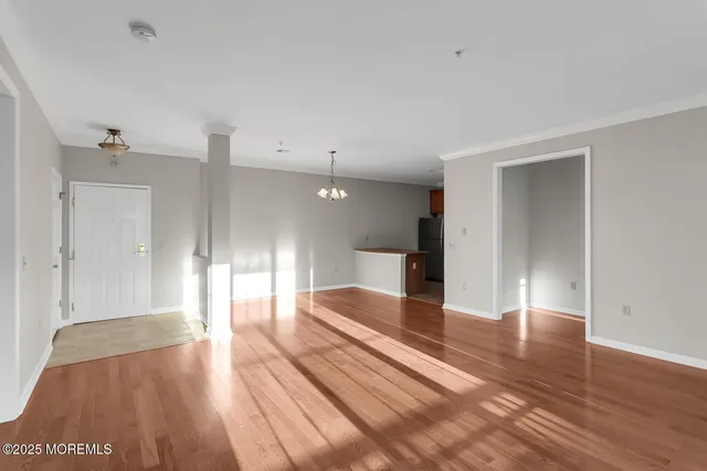 a view of gallery with wooden floor