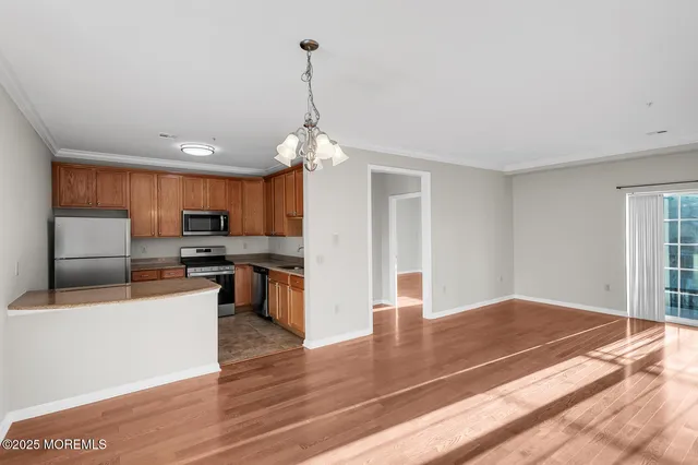 a view of kitchen with sink microwave and stove