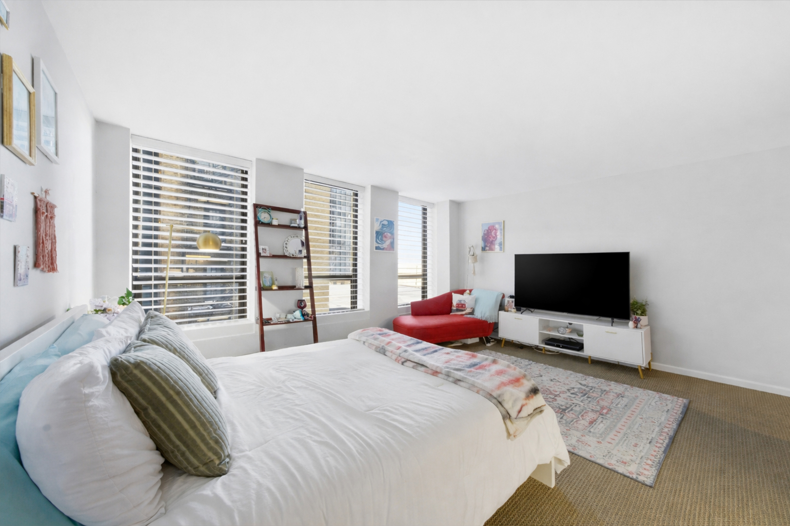 260 East Chestnut Street, Unit 406 Chicago, IL 60611 - Photo 3 of 25 a bedroom with a bed and a flat screen tv