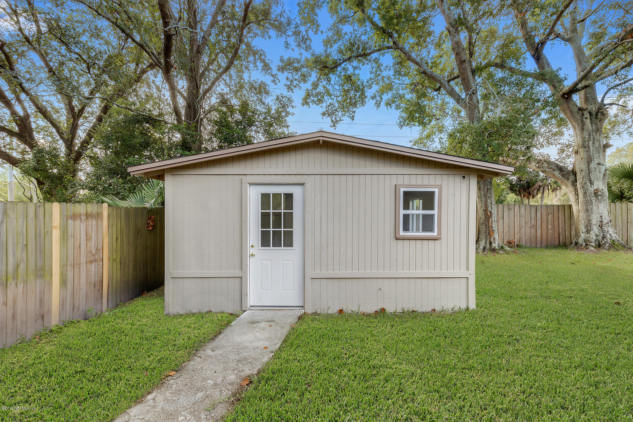 6914 Arques Road Jacksonville, FL 32205 - Photo 30 of 30 a white house that has tree in front of it