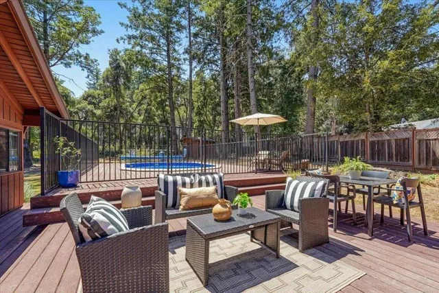 a view of a patio with couches chairs and a potted plant