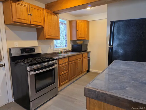 a kitchen with a sink and a refrigerator