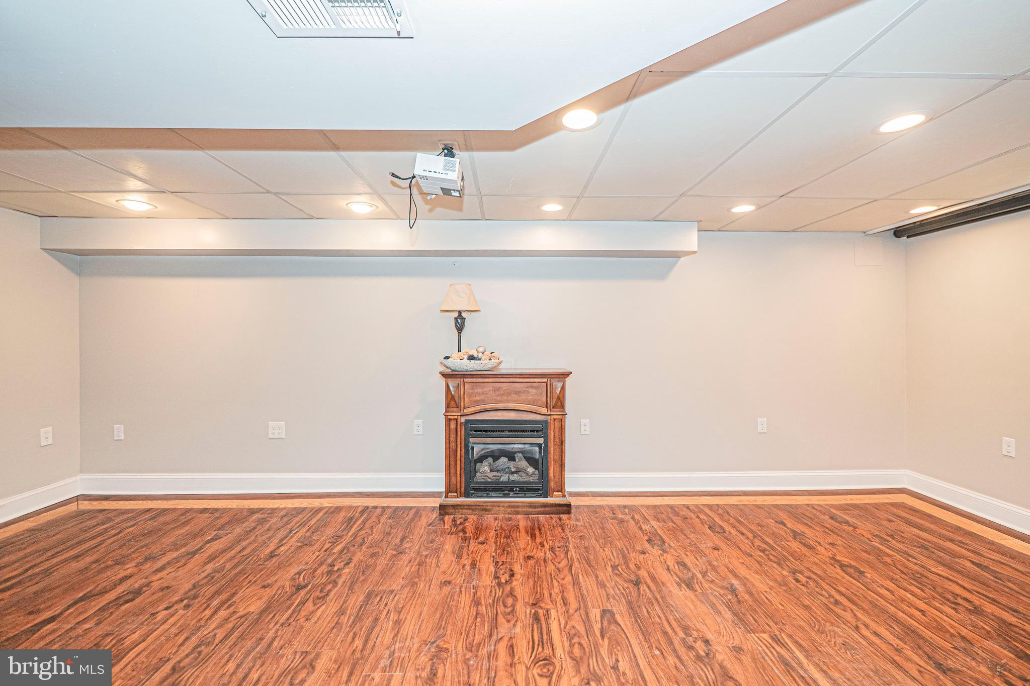 103 Nursery Road Linthicum Heights, MD 21090 - Photo 38 of 60 Lower Level - Rec Room w/ Electric Fireplace