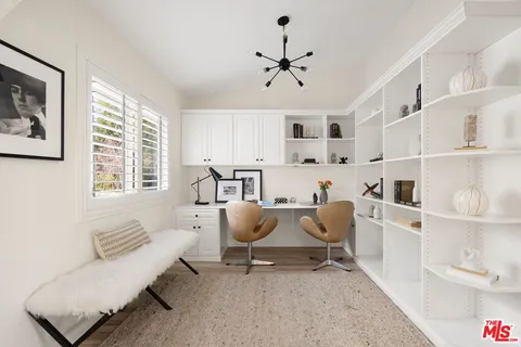 a living room with furniture and windows