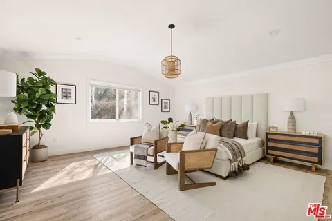 a bedroom with bed and a window