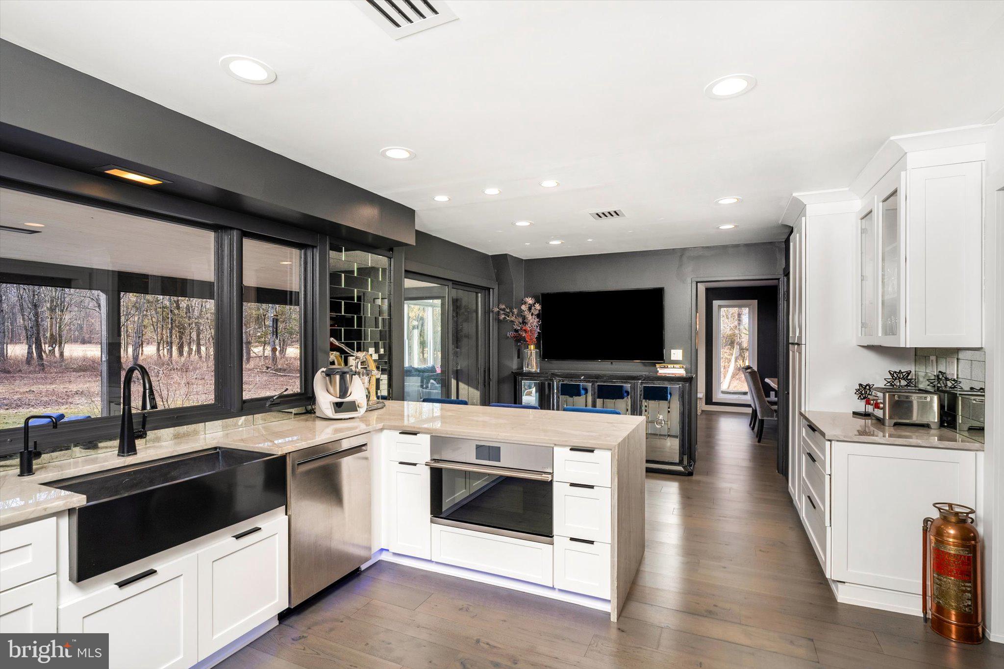 1615 Harbourton Rocktown Road Lambertville, NJ 08530 - Photo 13 of 50 a open kitchen with stainless steel appliances kitchen island granite countertop a stove and a sink