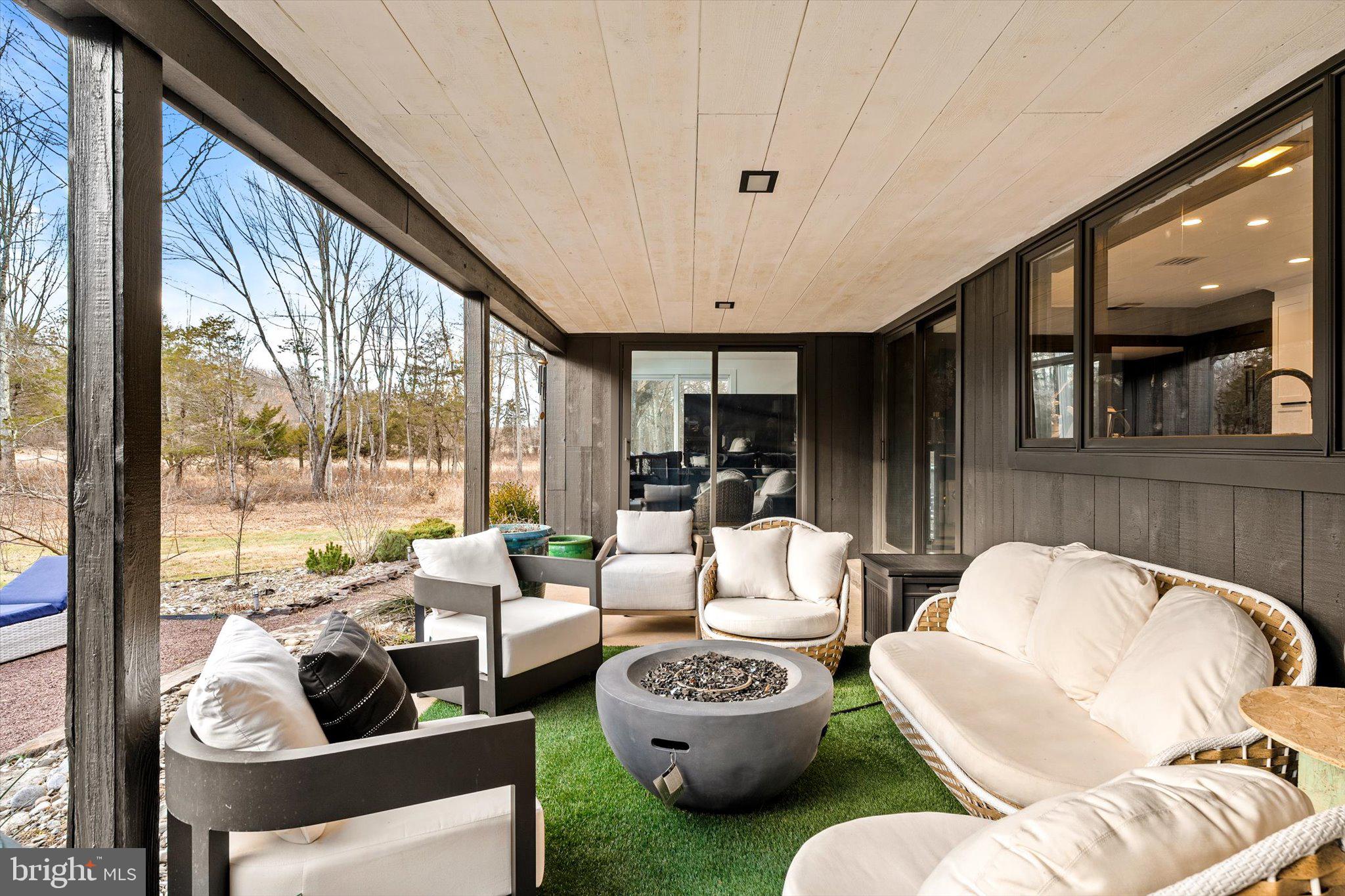 1615 Harbourton Rocktown Road Lambertville, NJ 08530 - Photo 17 of 50 a living room with furniture and a floor to ceiling window