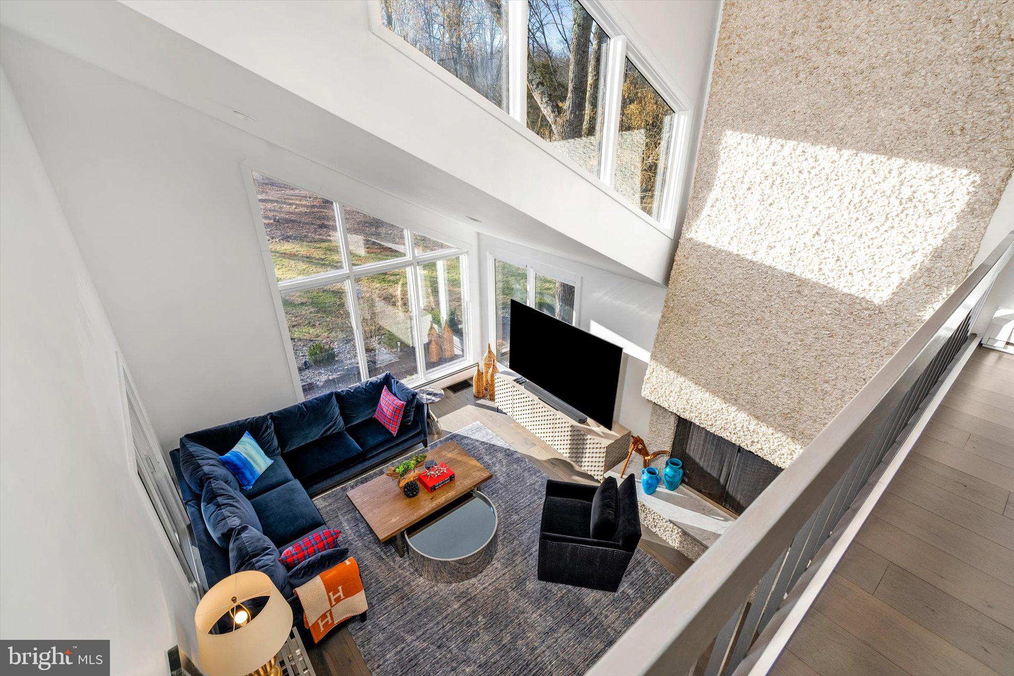 1615 Harbourton Rocktown Road Lambertville, NJ 08530 - Photo 21 of 50 a living room with furniture and a flat screen tv