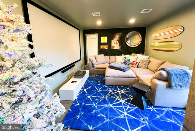 a view of a swimming pool with lawn chairs under an umbrella