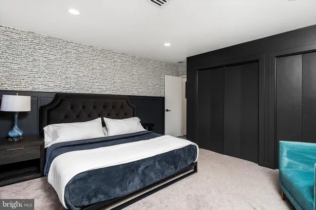 a bedroom with bed and window