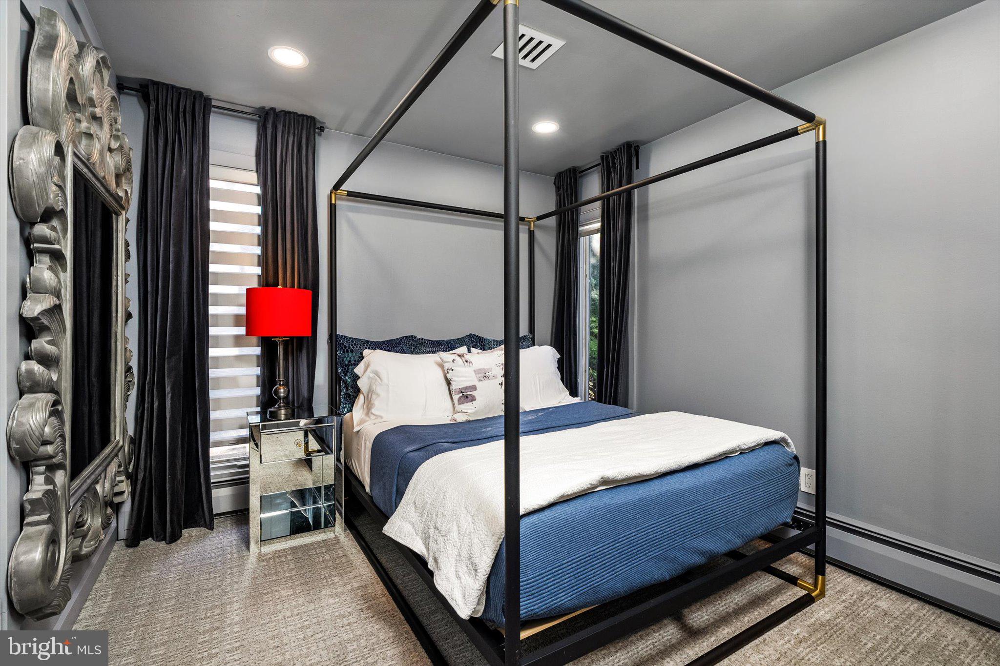 1615 Harbourton Rocktown Road Lambertville, NJ 08530 - Photo 32 of 50 a bedroom with a bed and a mirror