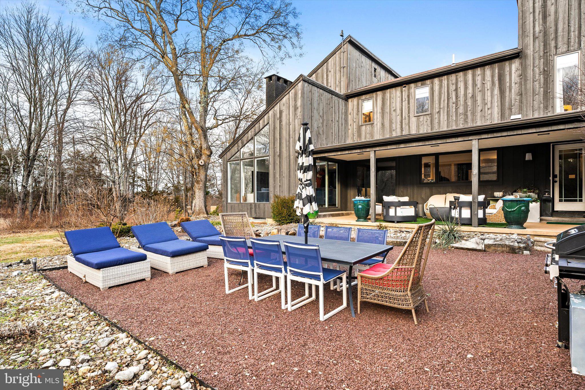 1615 Harbourton Rocktown Road Lambertville, NJ 08530 - Photo 46 of 50 a view of a house with a table and chairs in patio