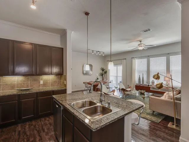 a kitchen with a sink and stove