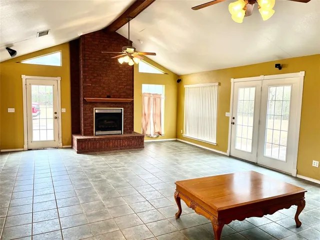 a view of livingroom with furniture and a fireplace