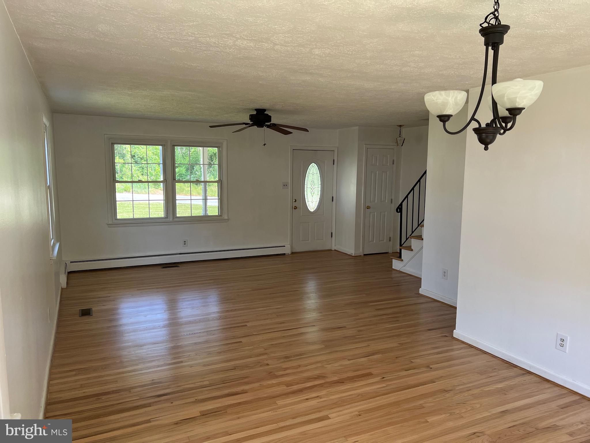 4729 Conowingo Road Darlington, MD 21034 - Photo 19 of 26 an empty room with wooden floor and windows