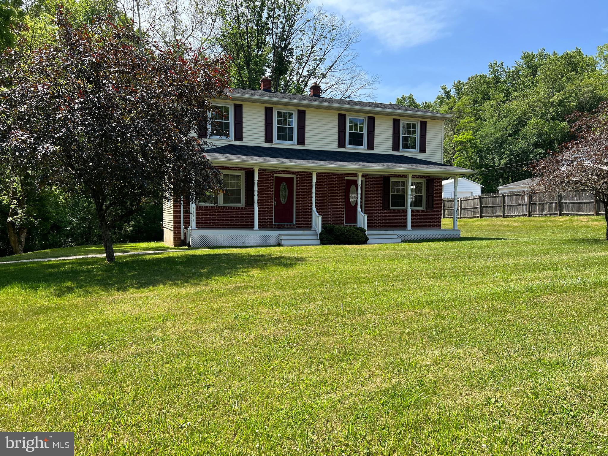 4729 Conowingo Road Darlington, MD 21034 - Photo 4 of 26 a view of a brick house with a big yard and large trees