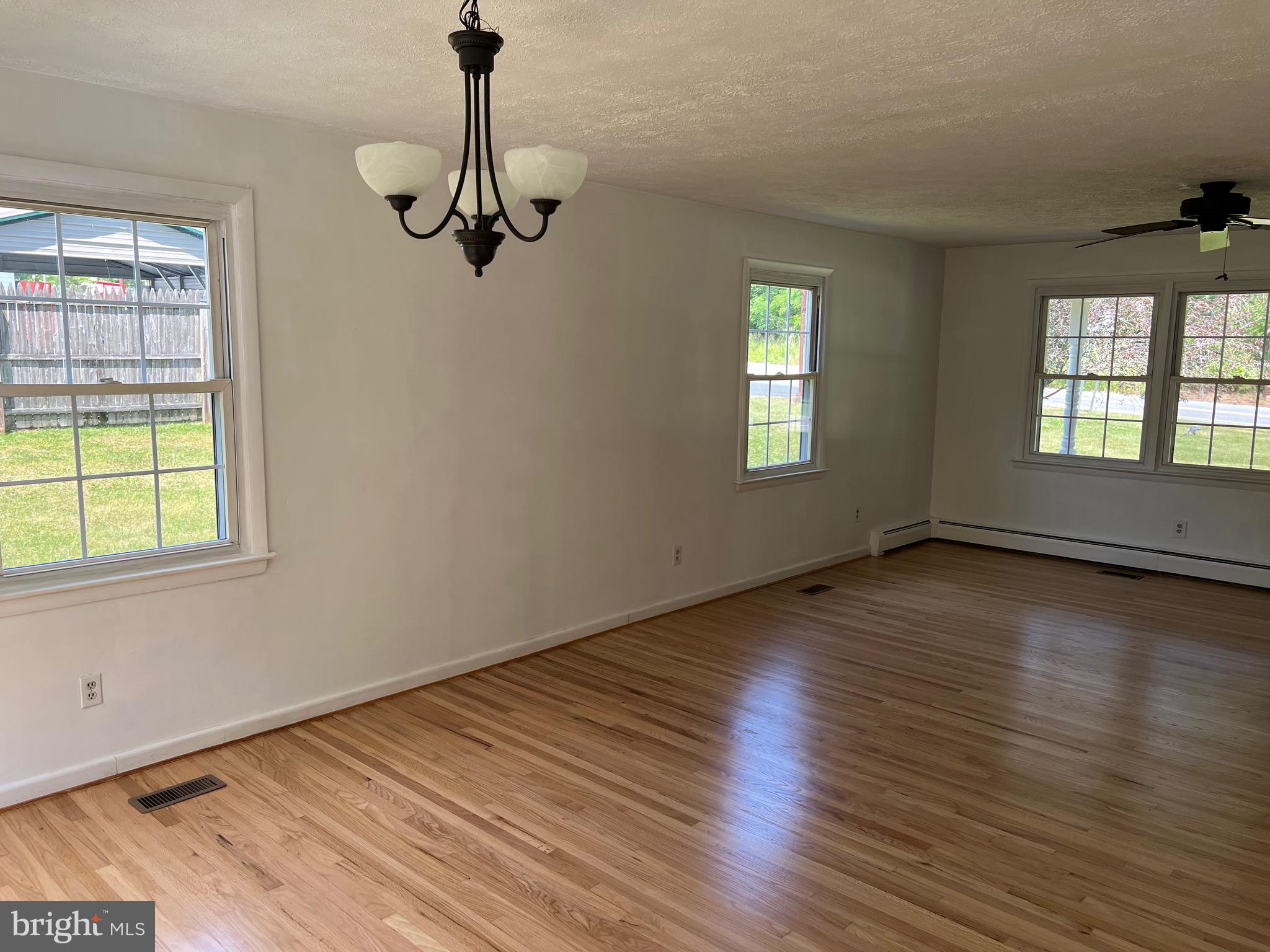 4729 Conowingo Road Darlington, MD 21034 - Photo 9 of 26 a view of empty room with wooden floor and fan