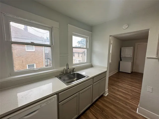 a kitchen with a sink and a window