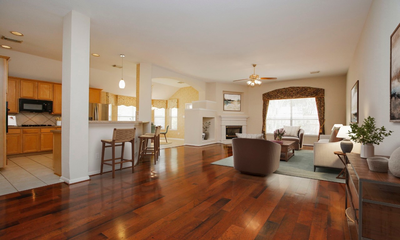 1114 Bringewood Chase Drive Spring, TX 77379 - Photo 12 of 49 a living room with furniture and wooden floor