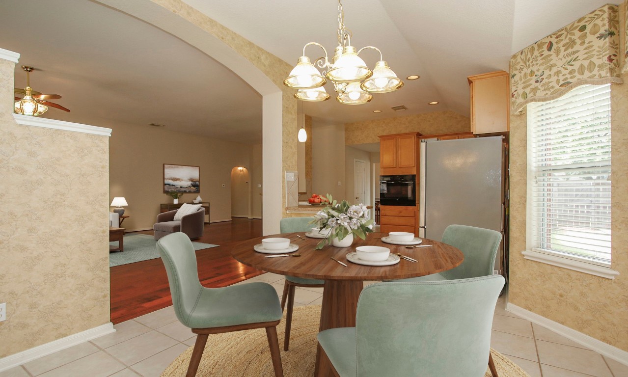 1114 Bringewood Chase Drive Spring, TX 77379 - Photo 20 of 49 a view of a dining room with furniture and chandelier