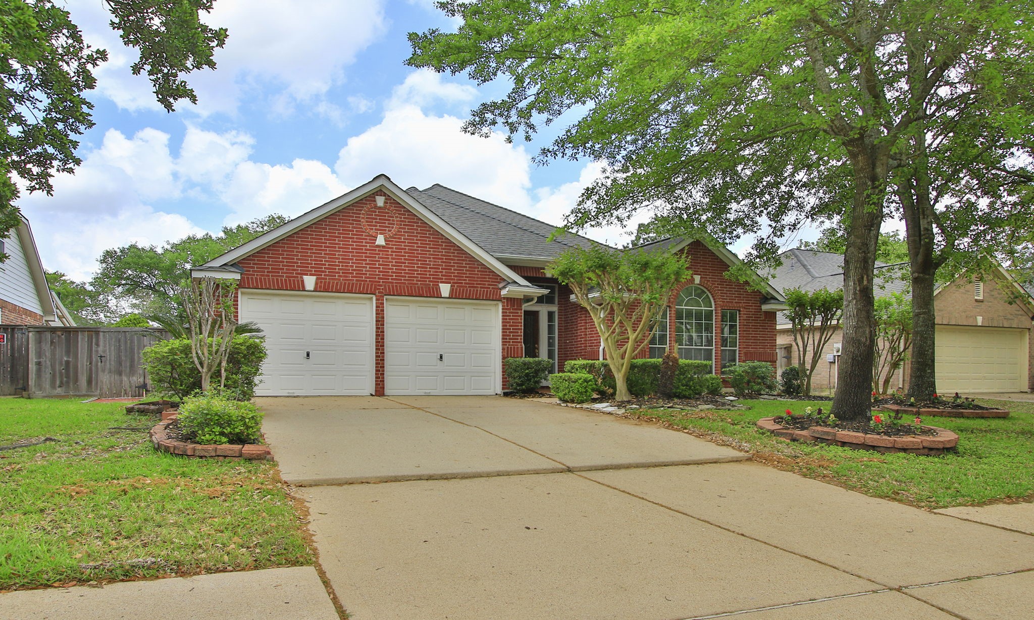 1114 Bringewood Chase Drive Spring, TX 77379 - Photo 3 of 49 a front view of a house with a yard and garage