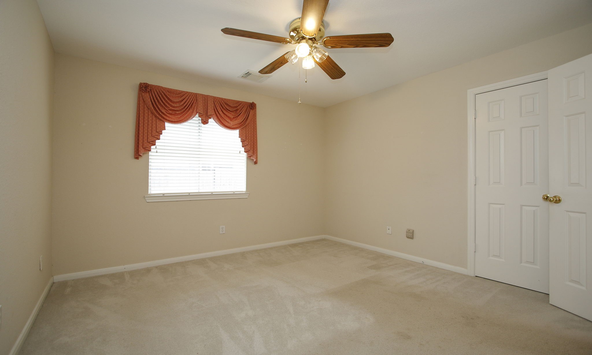 1114 Bringewood Chase Drive Spring, TX 77379 - Photo 31 of 49 an empty room with a window and a fan