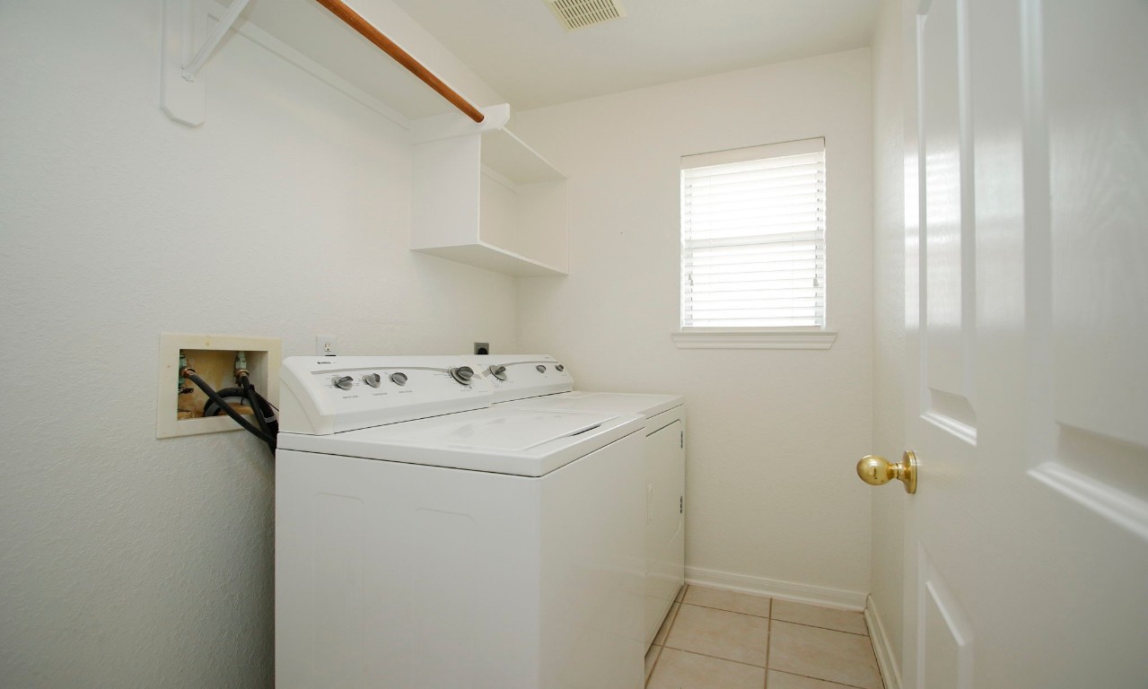 1114 Bringewood Chase Drive Spring, TX 77379 - Photo 33 of 49 a utility room with dryer and washer