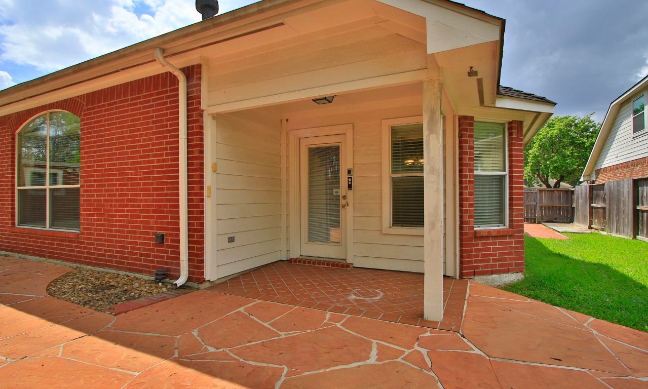 1114 Bringewood Chase Drive Spring, TX 77379 - Photo 34 of 49 a view of a house with a yard with plants