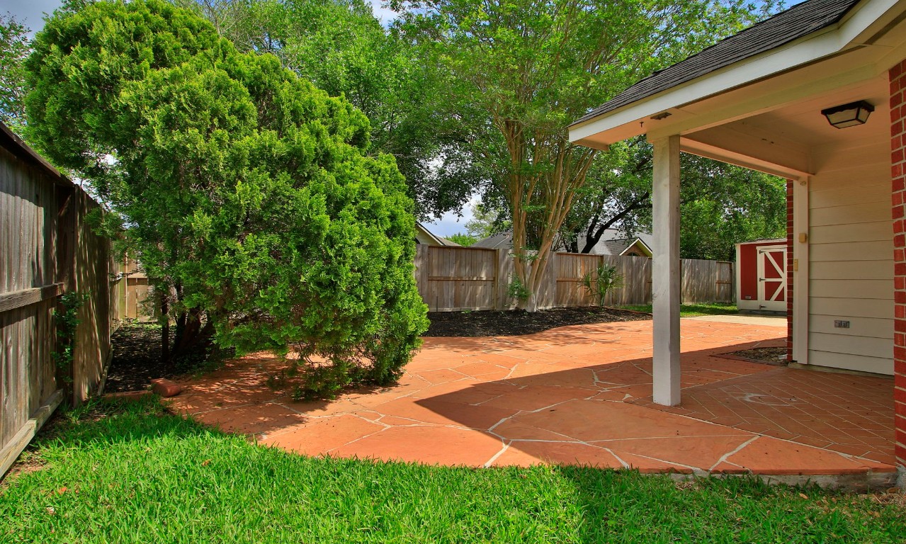 1114 Bringewood Chase Drive Spring, TX 77379 - Photo 35 of 49 Extended patio and mature plantings. Sprinklers.