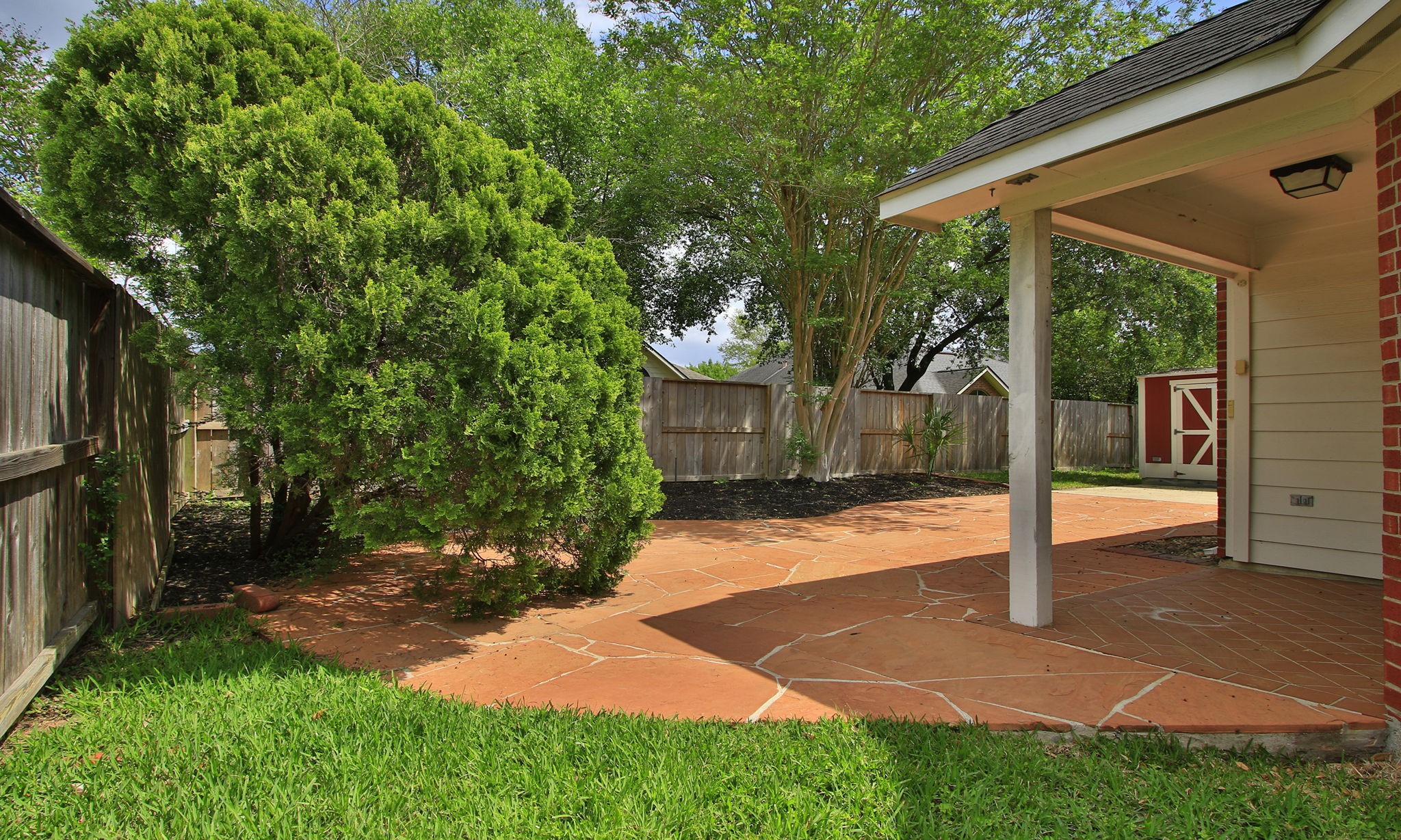 1114 Bringewood Chase Drive Spring, TX 77379 - Photo 35 of 44 Extended patio and mature plantings. Sprinklers.