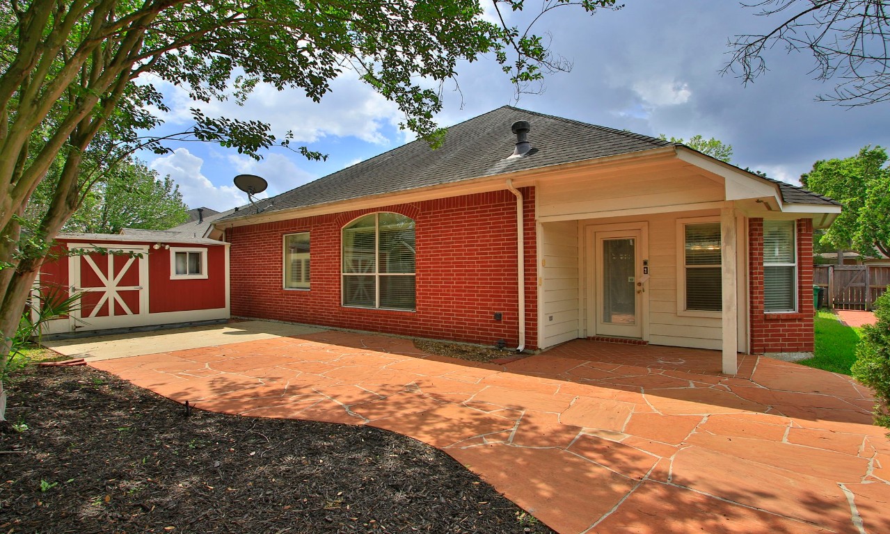 1114 Bringewood Chase Drive Spring, TX 77379 - Photo 37 of 49 a front view of a house with a yard