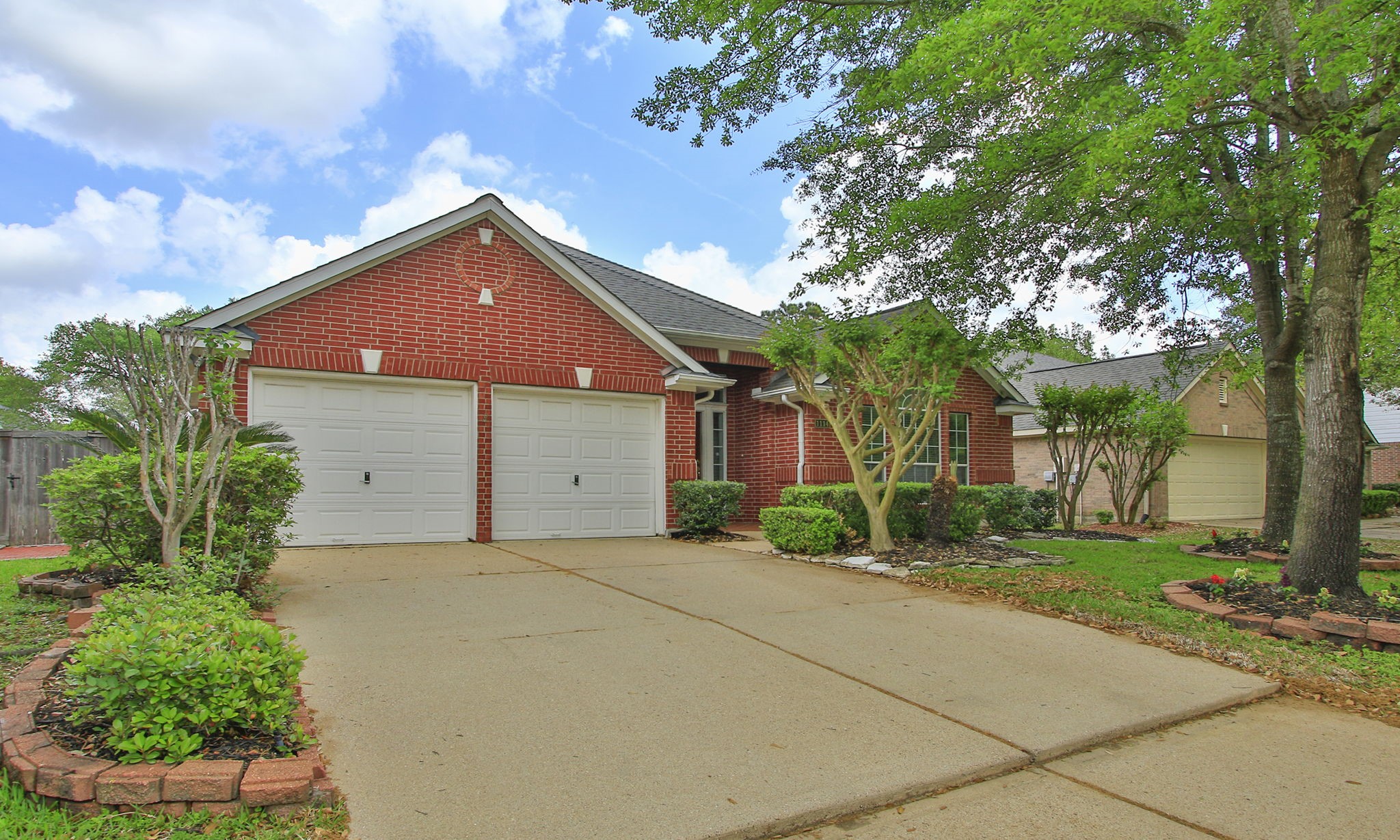 1114 Bringewood Chase Drive Spring, TX 77379 - Photo 4 of 44 Freshly power washed driveway and sidewalk
